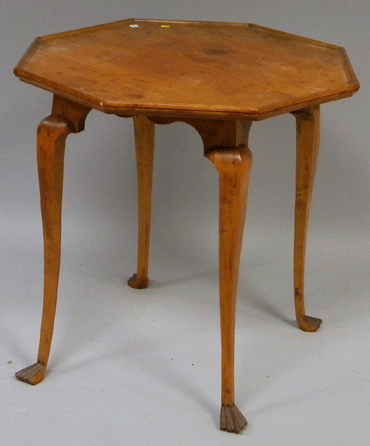 The top lot of the auction was this Queen Anne-style octagonal tray-top maple and pine tea table with paw feet that soared over its estimate to attain $17,775.