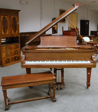 A Steinway & Sons mahogany baby grand piano with bench and ivory keys, the underside of case impressed 159811 P3033, fetched $9,480.