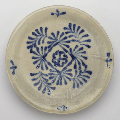 Blue and white dish. This piece, along with two others found in the wreck, represents the earliest intact and complete designs of the vastly influential and distinctive ceramic style known as blue and white. This piece was likely produced for export, and this style would become vastly important in the history of world ceramic †not only in the contemporary Middle East, but also in modern Europe, where blue and white developed into a prime trade good between England and the United States. Smithsonian's Freer and Sackler Galleries .