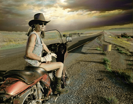 Mixing the old and the new, photographer Greg Mac Gregor's "Highway 41, New Mexico,†2009, shows a young woman decked out in cowboy hat and boots and shorts astride her motorcycle or "mechanical horse.†It is a kind of tongue-in-cheek Western fashion shot. Courtesy of Greg Mac Gregor.