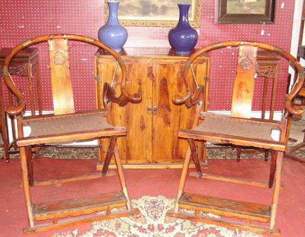 This pair of huanghuali hunting chairs soared to $26,880, while the huanghuali two-door cupboard finished at $2,800.