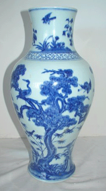 An Oriental vase, 16 inches tall, with peacocks and birds decoration brought $2,520.