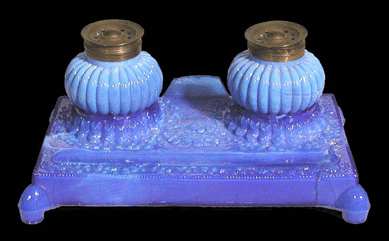 Desk set, Boston & Sandwich Glass Co., Sandwich, Mass., circa 1830, pressed, mottled opalescent blue glass, 3 3/16   by 6 7/8  inches. Gift of Mrs Robert Fairbairn, 1997.