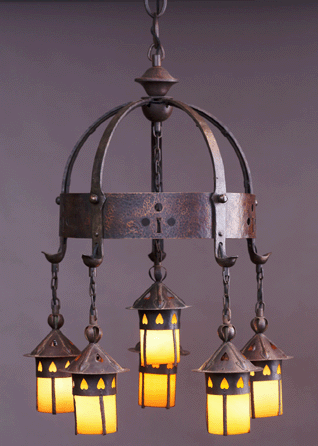 Attractive, affordable and useful, five-light electroliers such as this, made of iron, copper and glass at Craftsman Workshops around 1904, epitomized Stickley's mastery of proportion. It is 48 by 24 inches, with a 17-inch chain. Crab Tree Farm.
