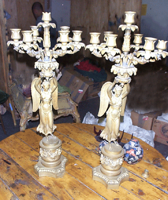 This pair of Nineteenth Century angelic figural bronze candelabras, unsigned, 2 feet tall with full wings extended, went to a phone bidder from Connecticut for $5,250.