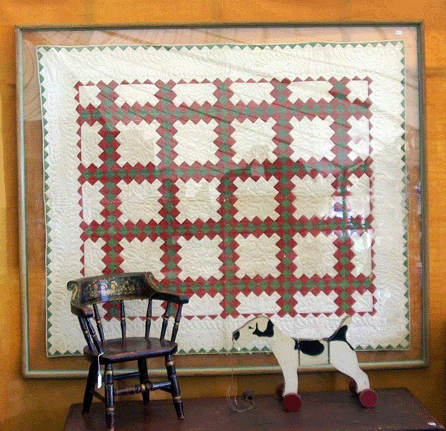 Jan and Ken Silveri, Hamburg, Penn., were offering a Lancaster County crib quilt in framed display for $475.