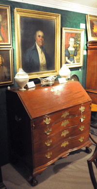 The Chippendale slant lid desk sold at $8,625; the oil on canvas laid on board of "Captain Joseph Anthony†by Gilbert Stuart brought $29,900.