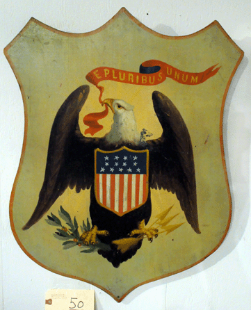 The wooden shield with paint decorated American eagle realized $9,487.