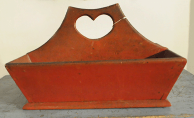 The knife box with heart-shaped cutout handle and finished in a vibrant "lipstick†red paint sold at $4,312.