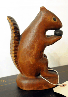 A carved folk art wooden squirrel reminiscent of a chalk figure sold for $2,645.