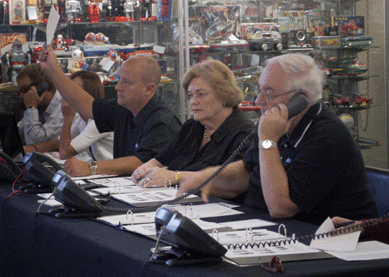 Staffing the phone bidding station, from left, were Dan, Janet and John Morphy.