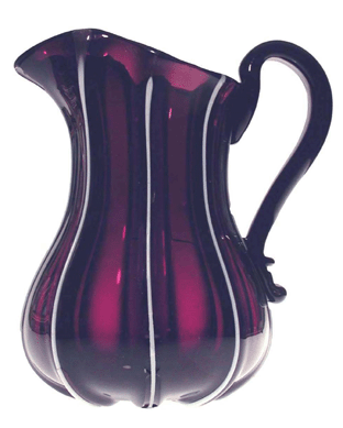 The amethyst pillar-molded glass pitcher appears to have white glass ribs, an effect achieved by applying white glass cane into the mold before the glass was added. It was probably made in Pittsburgh around 1860.
