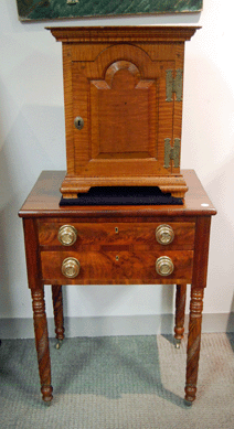 The Pennsylvania tiger maple spice chest was made in New London Township in Chester County and sold for $23,700. 