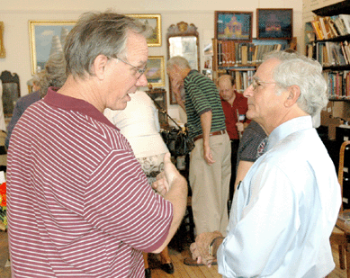 William Hosley, historian-lecturer, left, was among those attending, here "talking shop†with Arthur Liverant.