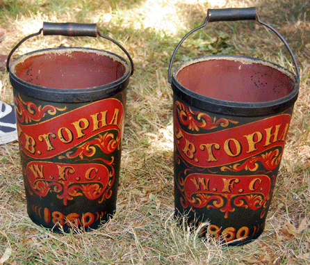 A pair of leather fire buckets thought to have come from a member of a fire company in Marblehead, Mass., went to the trade for $5,750.