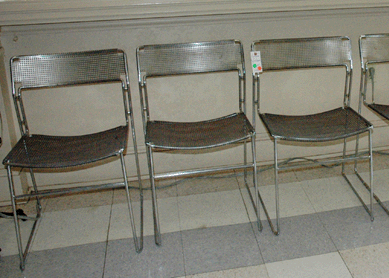 Ten retro metal stacking chairs from the 1970s (three shown) sold for $1,524.