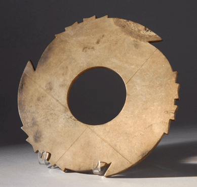 The large, at 10¼ inches, Chou dynasty Hsuan-chi notched disk in brown jade realized $57,500.