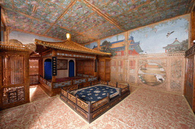 An interior view of the emperor's private theater to the left. The ceiling and walls are painted in trompe l'oeil murals.