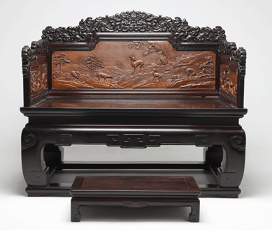 The zitan, cedar and lacquer throne with a matching footstool is carved with mountains and deer, harkening to the emperor's affinity for the mountains.