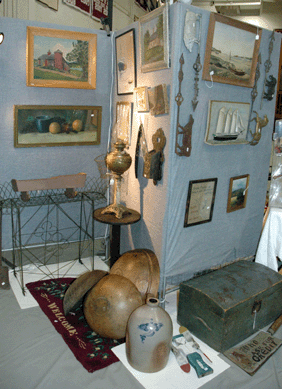 George B. Johnson and Celine Blais, Montpelier, Vt., made clever use of a folding craft show picture screen to show off their collection.