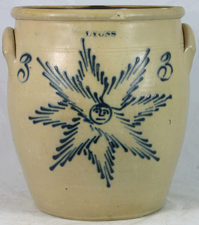 The top American stoneware lot in the sale was this 3-gallon cream pot marked Lyons with a signature star face design, fetching $10,725.
