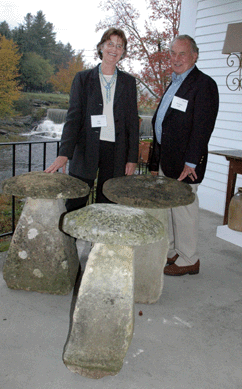 Sue and Jacques Lilly, Red Horse Antiques, Bridgewater, Vt., with three of their "pet†staddle stones that were getting a lot of notice outside on the playhouse's back porch.