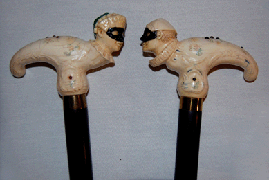 An early Twentieth Century pair of ivory canes carved in the form of Harlequin and Columbine in the manner of German porcelain and inlaid with gems fetched $4,888.