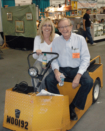 During the two-day setup there was only one way for Norm Schaut and show manager Gail Evans to get around and keep an eye on the Fun Fair. "I let her do the driving, opting for the safest way,†Norm said.