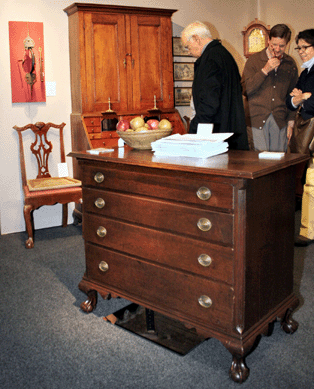 This rare Chippendale chest of drawers  has a cross-brace supporting its base, a feature characteristic of Litchfield County, Conn., furniture.  Nathan Liverant and Son Antiques, Colchester, Conn.