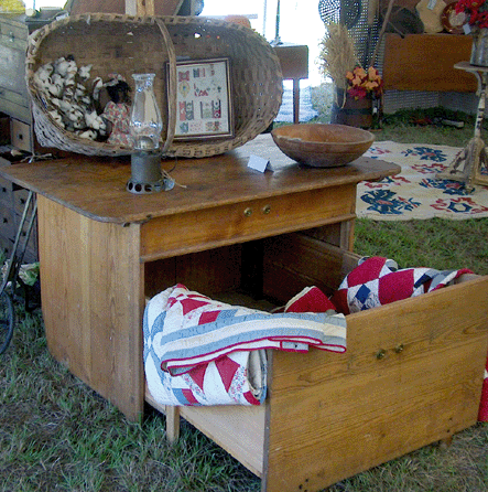 Frank and Pat Turner, Glendale, Texas, offered a large pine box under a table, which became a hired man's bed when fully extended, about 7 feet long, in Southern yellow pine and from early in the Nineteenth Century.