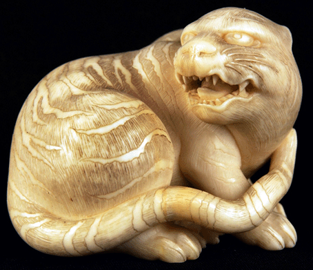 A katabori netsuke of a snarling cougar was signed and brought $37,050 from an English collector/dealer. 