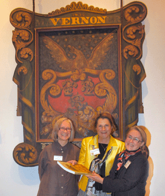 Unionville, Conn., appraiser Regina Madigan, right, gets her catalog signed by exhibition curator Susan P. Schoelwer, center, and Connecticut Historical Society director Kate Steinway, left.
