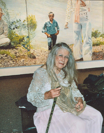 Sylvia Sleigh sits in front of one of the panels of her work, "Invitation to a Voyage: the Hudson River at Fishkill, 1979‹9,†on view at Hudson River Museum, Yonkers, N.Y.