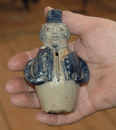 This rare and important figural stoneware bank in the form of a top-hatted gentleman, New York State origin, circa 1825, looks even smaller than its 5-inch height when handheld. This bank was recently discovered at a yard sale in Maine for $20 and the auction catalog reads that it "is possibly the finest and most elaborately decorated American stoneware bank known.†It carried a presale estimate of $10/15,000, and sold for $13,800, including the 15 percent buyer's premium. It was the top lot in the sale.