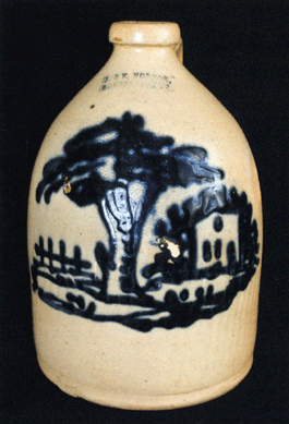 Rare, 1-gallon stoneware jug with slip-trailed cobalt house and tree scene, stamped "J. & E. Norton / Bennington, VT,†circa 1870, 11½ inches high, sold for $9,200, exceeding its high estimate of $6,000.