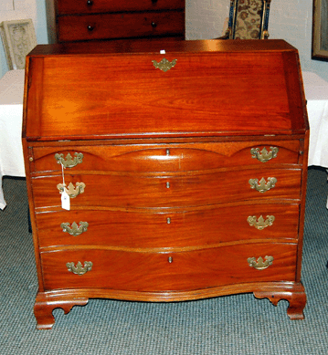 An Eighteenth Century Massachusetts oxbow slant lid desk made $2,300.