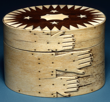 This box from the museum's outstanding scrimshaw collection was made between 1840 and 1856 of whale bone and ivory, mahogany, wood and tortoiseshell. It employs hands and stars as decorative motifs. 