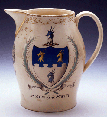 This transfer-printed creamware pitcher was made in Liverpool, England, around 1800 and measures 9 inches high. It is decorated with the Arms of Snow, an American eagle with 13 stars overhead and the three-masted ship Ann Alexander. 