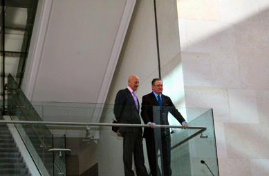 Lord Foster, founder and chairman of the London-based architectural practice Foster + Partners, and Malcolm Rogers, director of the Museum of Fine Arts, Boston, survey the Ruth and Carl J. Shapiro Family Courtyard from an upper landing moments before the new wing's dedication.