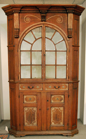 The Lancaster County, Penn., black walnut corner cabinet had sulphur and pewter inlay and sold for $259,000. 