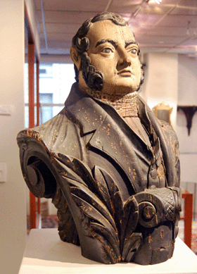 The ship's figurehead carved in the likeness of naval hero Commodore Matthew C. Perry sold on the phone for $100,725.