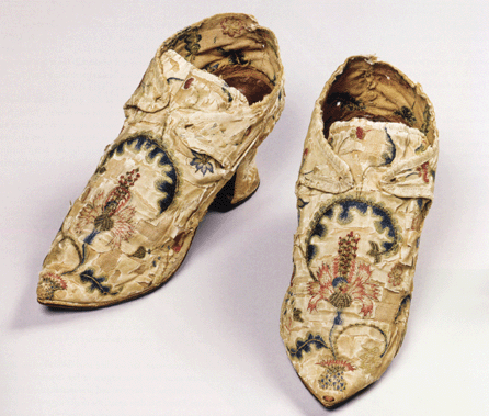 Shoes, probably made by Hannah Edwards Wetmore and Mary Edwards and worn by Hannah Edwards, probably East Windsor or possibly Middletown, Conn., circa 1745-46. Silk and metallic thread stitched on ribbed silk, plain-weave linen, kid leather rand and leather soles. Gift of Hannah Whittlesey, 1840. These shoes are among the first artifacts to be added to the historical society's collections. Perhaps each sister worked on one shoe, in order to have them ready in time for Hannah's January 1746 wedding, when she became the third wife of wealthy Middletown merchant Seth Wetmore.