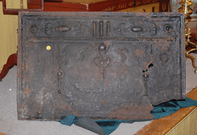 The cast iron rectangular fireback dated 1656 was thought to have been one of six or seven firebacks known to exist that were made at the Saugus Iron Works. It brought $31,050.