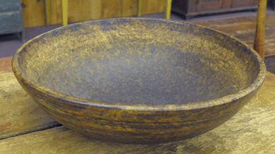 A nicely turned burl bowl opened with numerous absentee bids at $1,300 and sold in the gallery for $2,185.