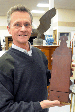 Auctioneer Ed Nadeau with a Queen Anne pipe box, another of the treasures to surface, with it selling at $3,450.