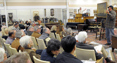 Nadeau sells the Smith ship portrait before a full house.