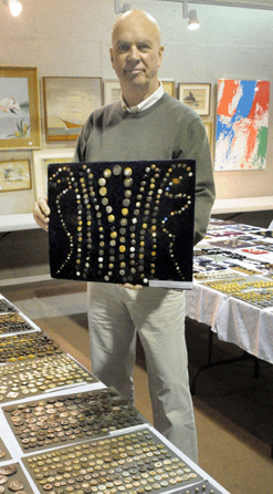 Auctioneer Hap Moore among the thousands of buttons sold during the auction.