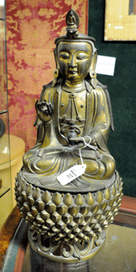 The early two-part Chinese gilt bronze Buddha on a lotus-form base was bid to $50,600.