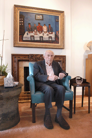 Roy Neuberger is pictured in his New York apartment in January 2005 in front of a Marsden Hartley painting, "Fishermen's Last Supper,†as part of a cover article in Antiques and The Arts Weekly.