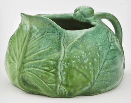 This squat creamer with water lily pads and buds is only 3 inches tall, yet it makes a strong statement. Courtesy of a New York private collection.